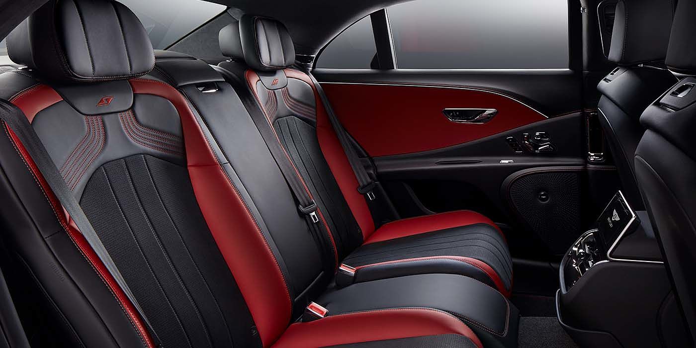 Bentley Valencia Bentley Flying Spur S sedan rear interior in Beluga black and Hotspur red hide with S stitching