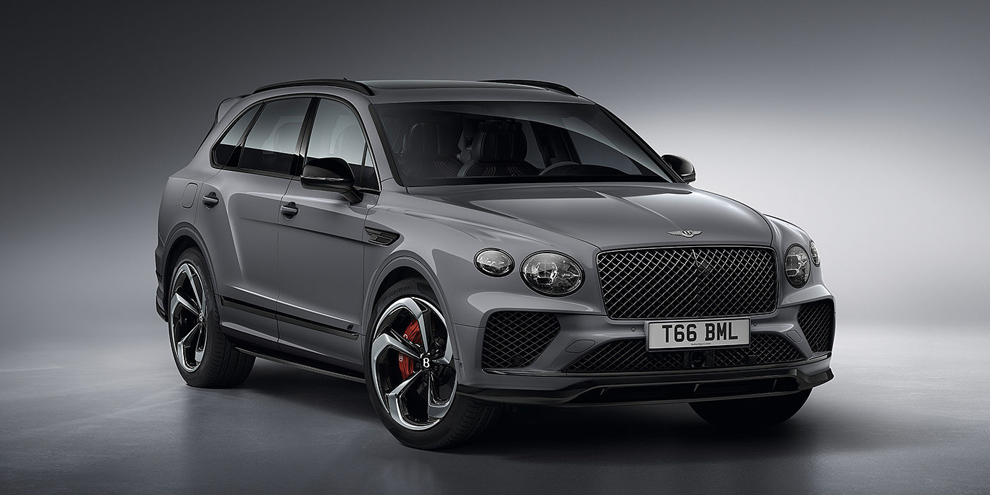 Bentley Valencia Bentley Bentayga S in Cambrian Grey paint front three - quarter view with dark chrome matrix grille and featuring elliptical LED matrix headlights. 