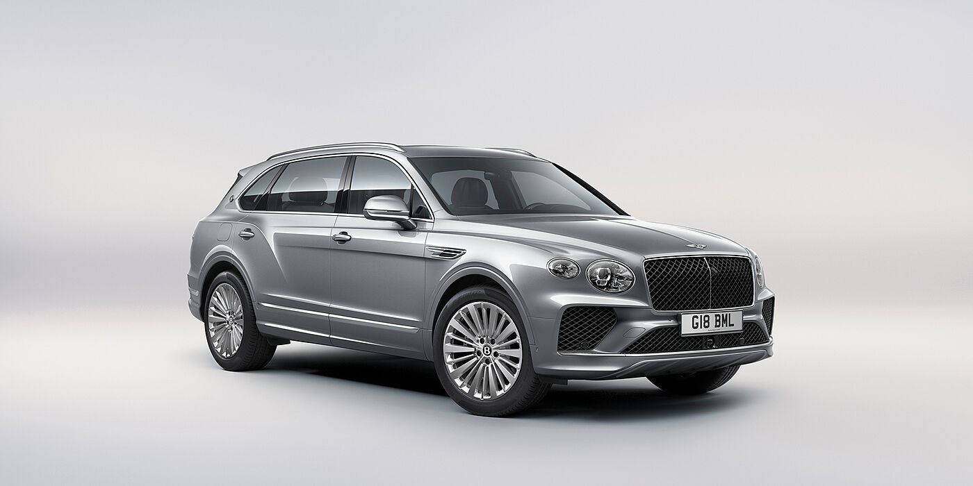 Bentley Valencia Bentley Bentayga Extended Wheelbase luxury SUV front three quarter view in Moonbeam paint with 21 inch five spoke painted wheels