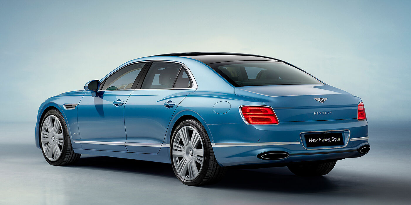 Bentley Valencia New Bentley Flying Spur Azure sedan rear view in Light windsor blue by Mulliner paint with 22 inch Azure wheels and chrome exterior details