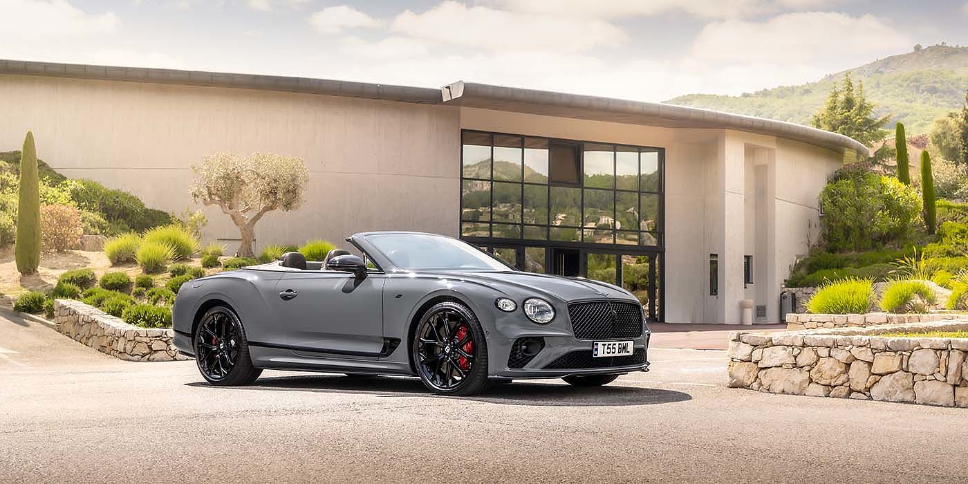 Bentley Valencia Bentley Continental GTC S convertible in Cambrian Grey paint front 34 static near house