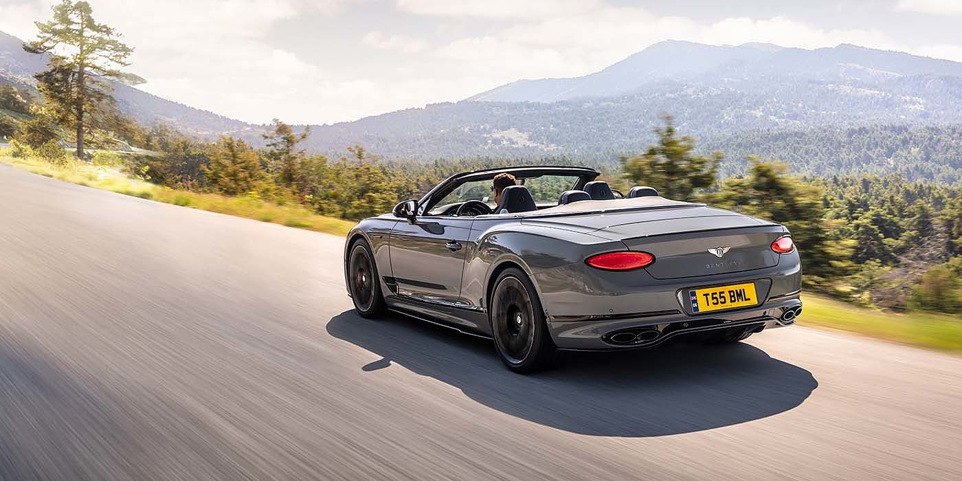 Bentley Valencia Bentley Continental GTC S convertible in Cambrian Grey paint rear 34 dynamic driving