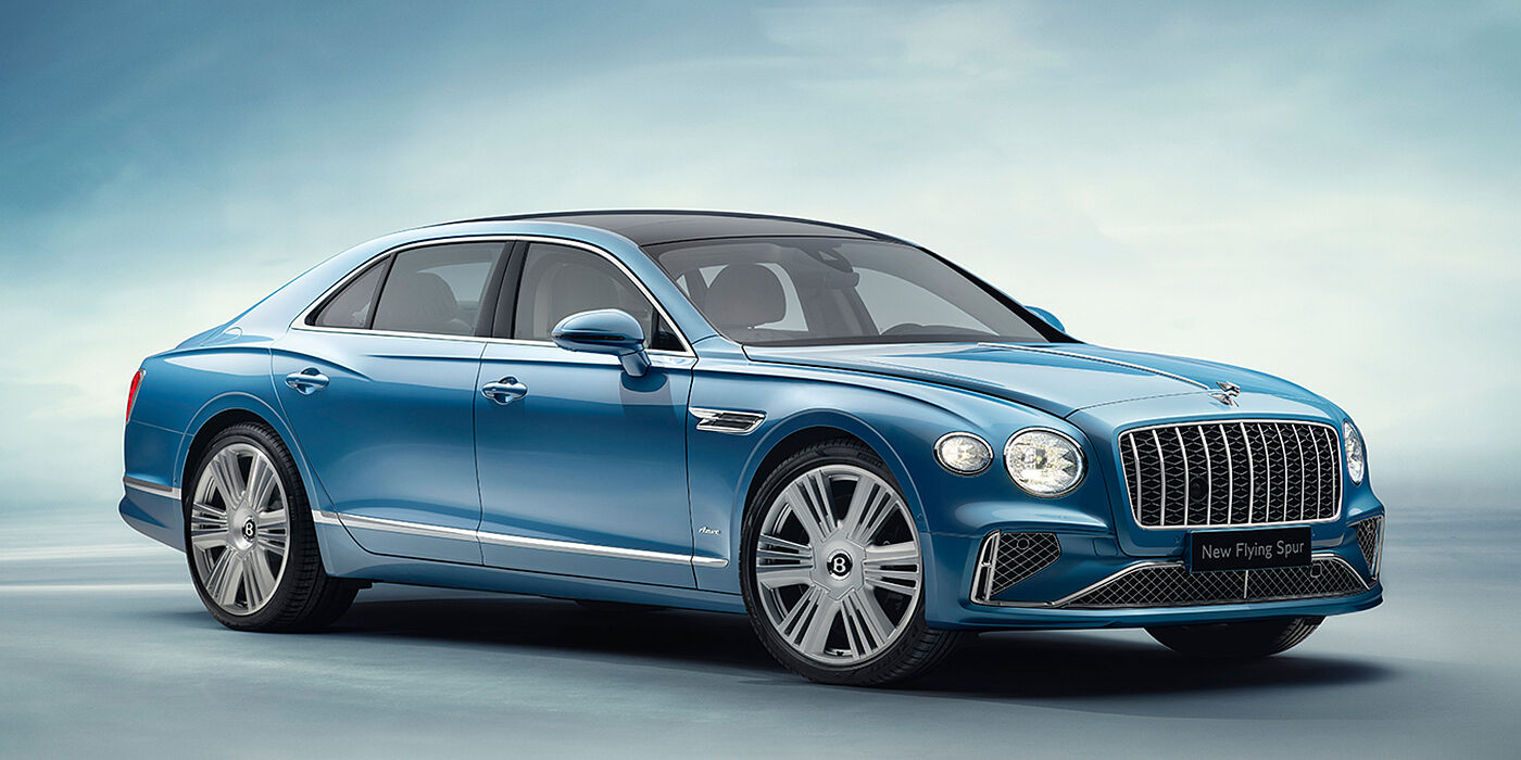 Bentley Valencia New Bentley Flying Spur Azure sedan front view in Light windsor blue by Mulliner paint with 22 inch Azure wheels and chrome exterior details