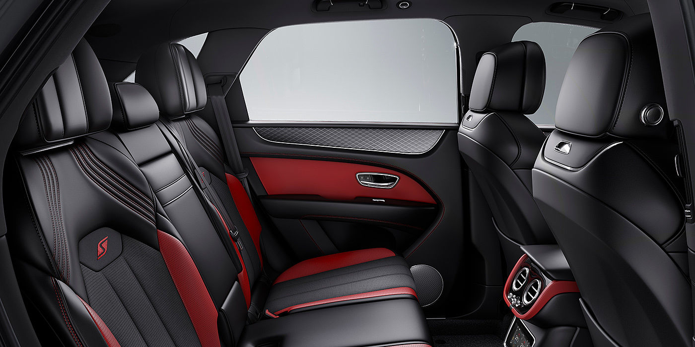 Bentley Valencia Bentey Bentayga S interior view for rear passengers with Beluga black and Hotspur red coloured hide.