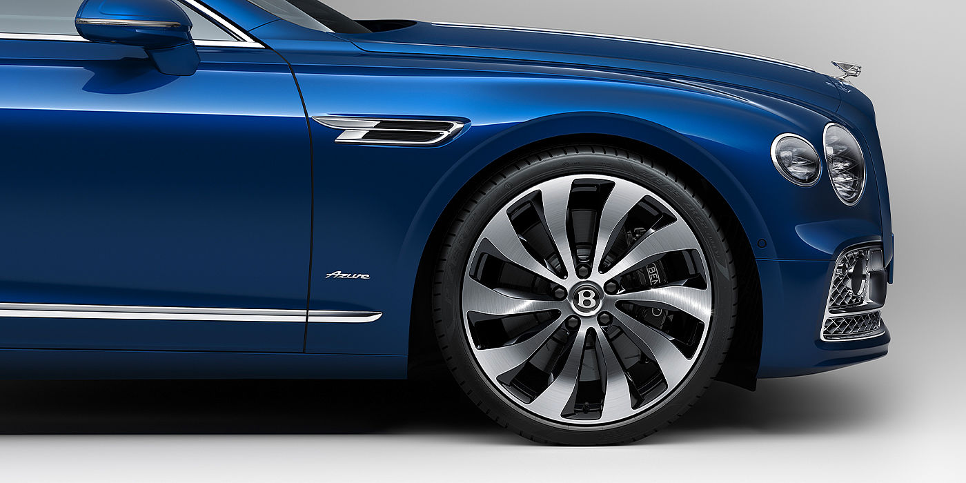 Bentley Valencia Bentley Flying Spur Azure sedan side close up in Sequin Blue paint with Azure badge