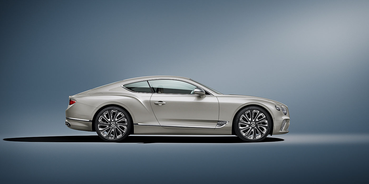 Bentley Valencia Bentley Continental GT Mulliner coupe in White Sand paint front 34