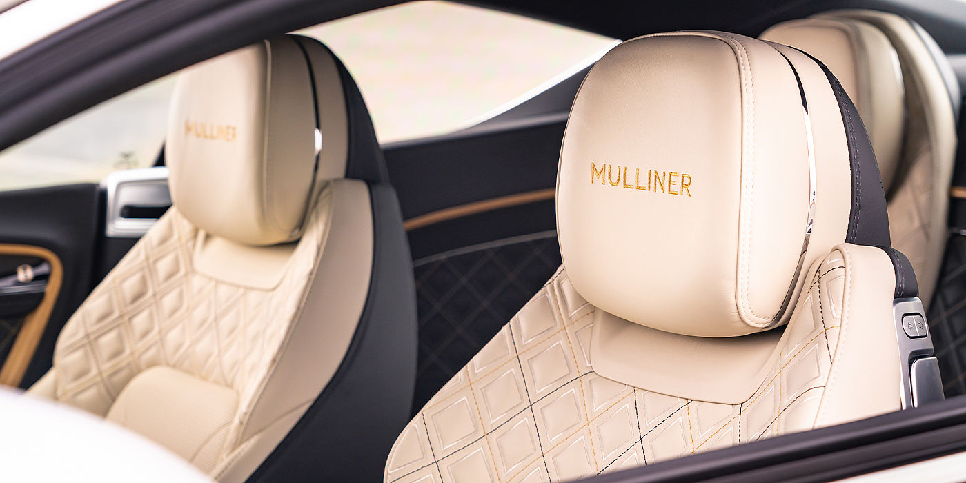 Bentley Valencia Bentley Continental GT Mulliner coupe seat detail in Beluga black and Linen hide