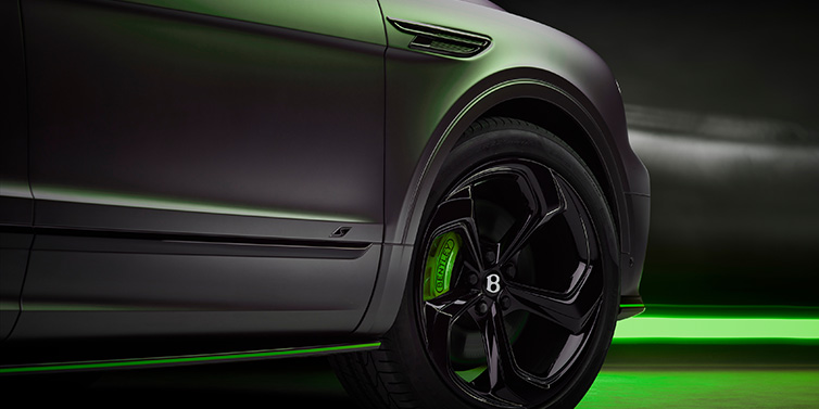 Bentley Valencia Bentley Bentayga S Black Edition SUV exterior wheel detail with Cyber Green brakes with Anthracite Satin paint