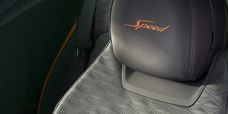 Bentley Valencia Bentley Continental GT Speed coupe seat detail in Gravity Grey hide and Speed emblem in Mandarin by Mulliner coloured embroidery